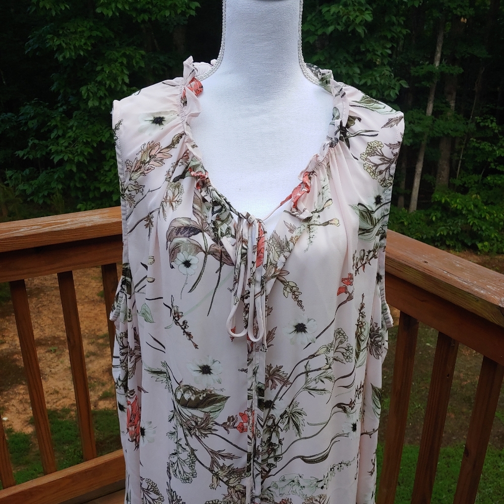 Sleeveless pink floral blouse